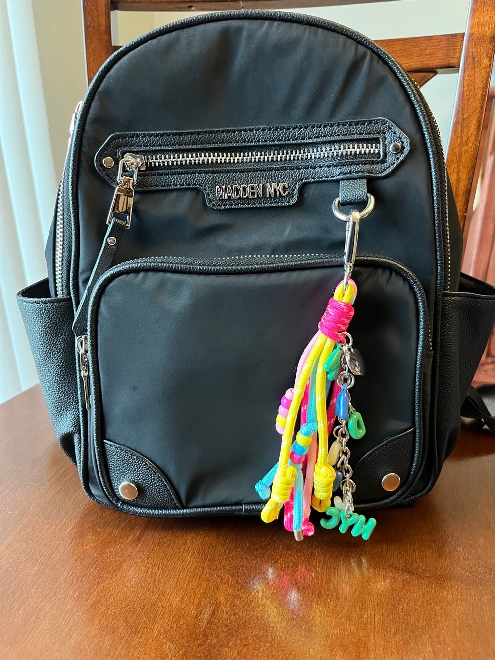 Madden NYC Black Women's Backpack with Neon Tassel Charm